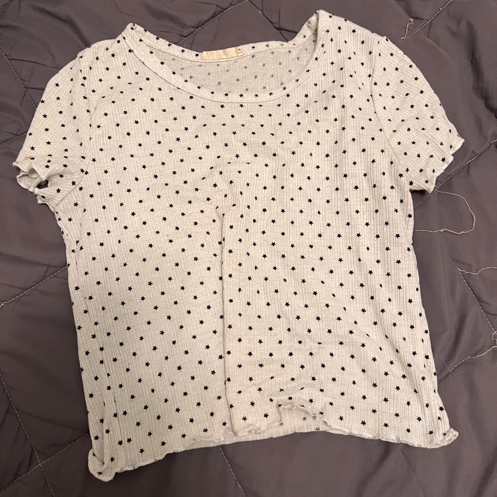 white ruffle shirt with mini black starts